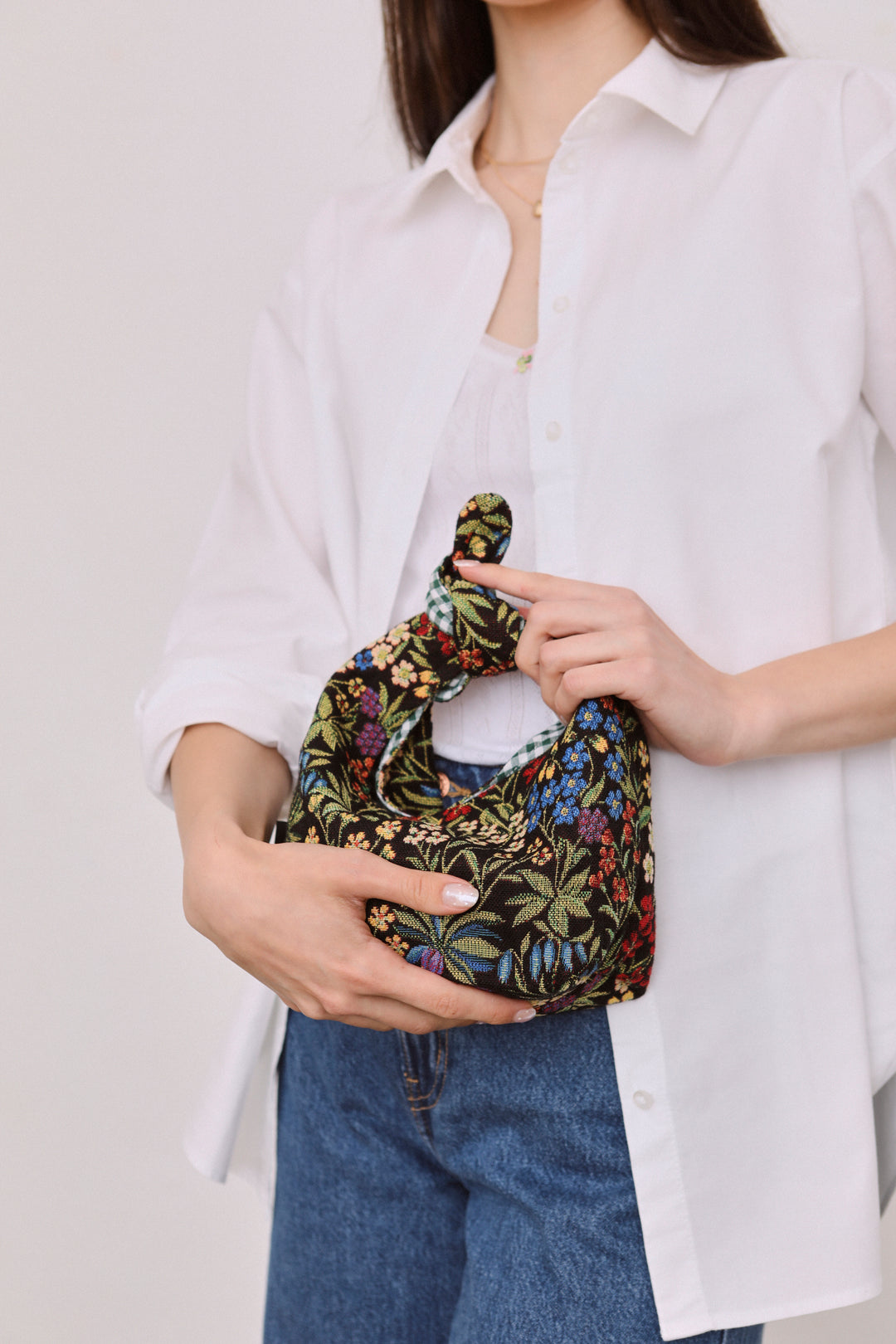 Bolso mano anudado tejido jacquard margaritas