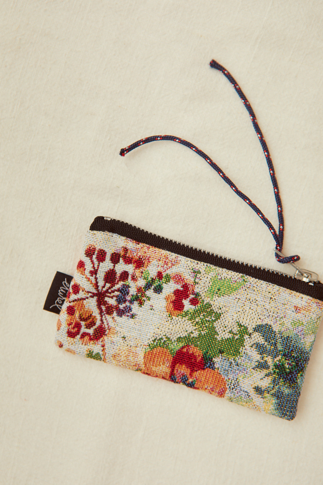 Monedero tejido jacquard flores amapolas