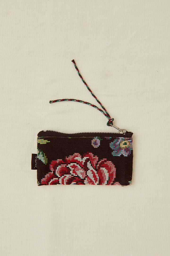 Monedero tejido jacquard flores peonías